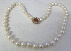 String of pearls with 9ct gold seed pearl and citrine clasp length 18.