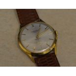 Gold plated body J W Benson, London wristwatch on a leather strap,