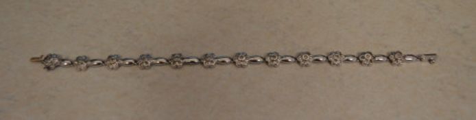 Italian marked 18ct flower bracelet, total approx weight 12.