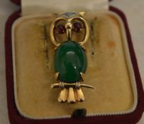 9ct gold and semi precious stone brooch in the shape of an owl perched on a small branch,