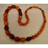 A graduated opaque amber bead necklace, of approx 42 beads, total weight approx 43 g,