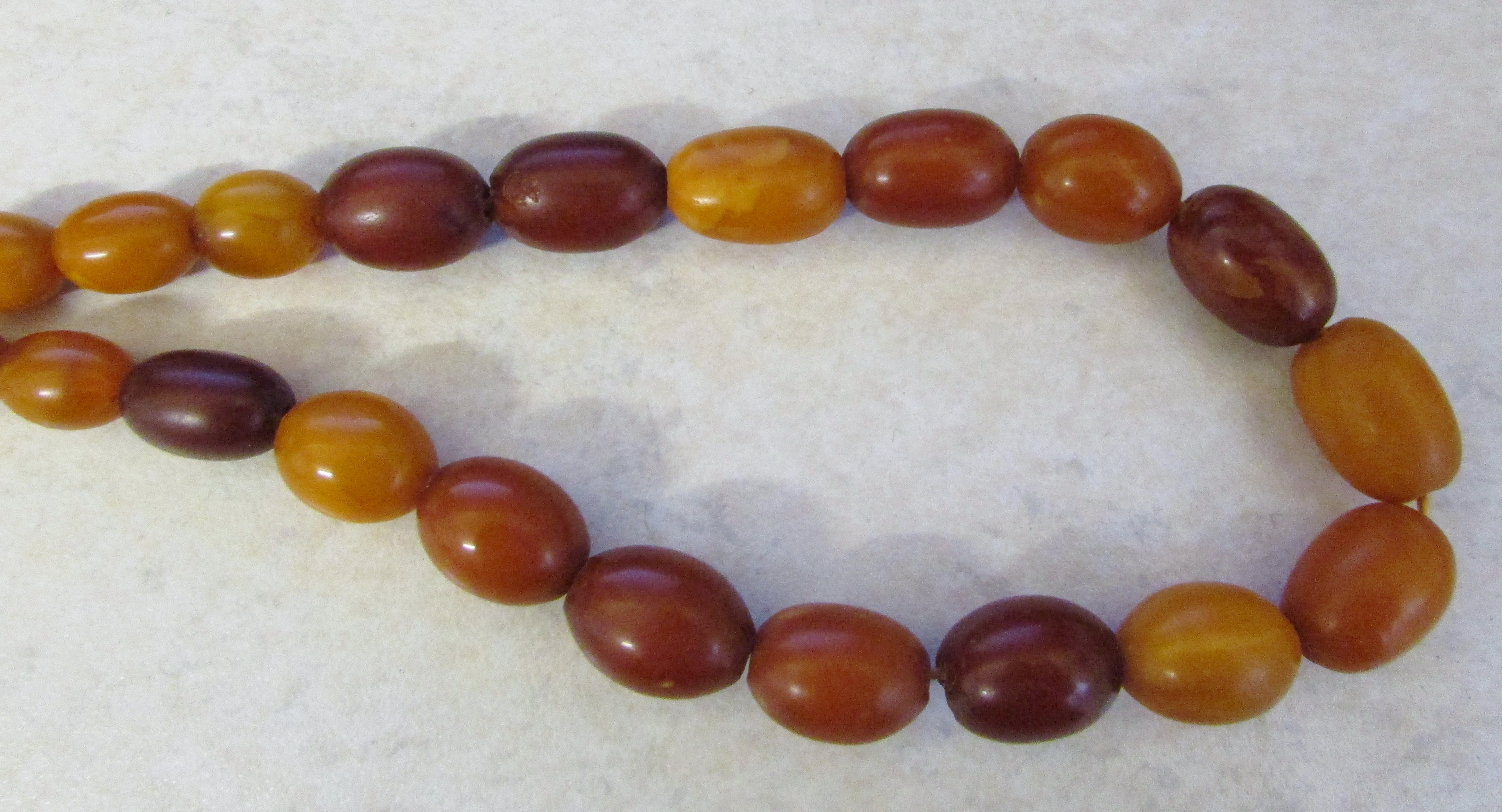 A graduated opaque amber bead necklace, of approx 42 beads, total weight approx 43 g, - Image 5 of 5