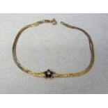 9ct gold two strand bracelet with sapphire flower total weight 2.