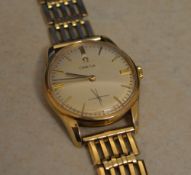 9ct gold Omega gents wristwatch on a 9ct gold gate style strap (hallmarked body and strap) with