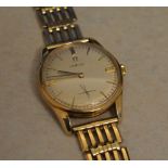 9ct gold Omega gents wristwatch on a 9ct gold gate style strap (hallmarked body and strap) with