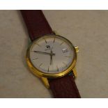 Tissot yellow metal wristwatch on a leather strap