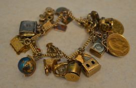 A 9ct gold charm bracelet with approx 22 good quality charms,