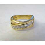18ct gold diamond cross over band ring with 0.