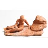 David Arnatt: a terracotta figure, nude by a rock, monogrammed 1981, 5 1/2" high