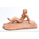 David Arnatt: a terracotta figure, nude on the rocks, monogrammed, 7 1/2" high