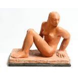 David Arnatt: a terracotta figure, seated nude, monogrammed, 9 1/4" high
