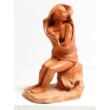 David Arnatt: a terracotta figure, seated nude in wind blown towel, monogrammed, 14" high