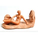 David Arnatt: a terracotta figure, nude with rocks, monogrammed 1981, 6 1/4" high