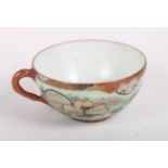 A set of twelve oriental eggshell porcelain teacups and eleven saucers, a similar cup and saucer,