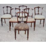 A set of six late Victorian polished as walnut dining chairs with narrow pierced splats and