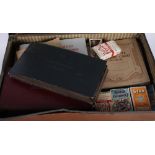 A collection of early 20th Century cigarette cards, loose and in albums, in attaché case