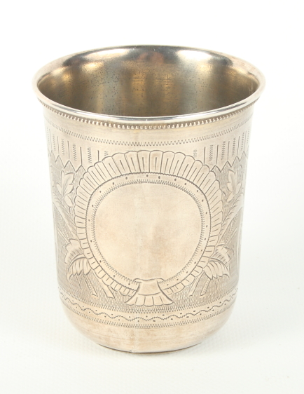 A Russian silver beaker with sides engraved foliage and vacant cartouche, 3 1/2" high