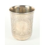 A Russian silver beaker with sides engraved foliage and vacant cartouche, 3 1/2" high