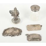 Two silver decanter labels, a plated label, a glass salt with plated top and a plated figure of a