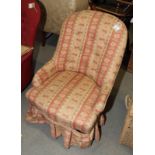 A Victorian nursing chair fitted brown and beige loose cover, on turned supports