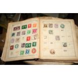 A collection of World stamps, loose and in two albums