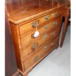 An 18th Century walnut and line inlaid chest of four long drawers fitted brass handles, on bracket