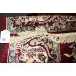 A Tabriz design red ground rug, 79" x 55" approx