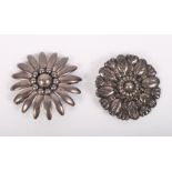 A Danish silver brooch formed as a flower head and another similar