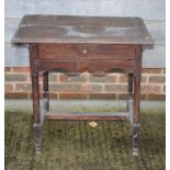 An 18th Century oak rectangular occasional table, fitted shallow frieze drawer, on plain turned