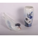 A Royal Copenhagen tern, 10 1/4" long, and a Royal Copenhagen vase decorated daisies, 6 1/2" high