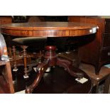 A 19th Century mahogany circular tilt top dining table, on turned pillar and tripod base