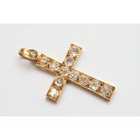 A gold and diamond crucifix set thirteen old cut stones