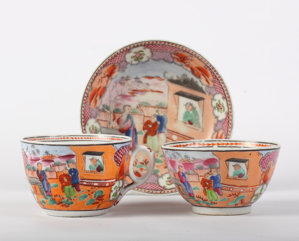 A New Hall "boy in the window" pattern tea bowl cup and saucer