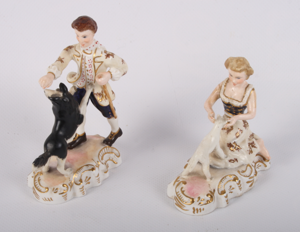 A pair of Royal Crown Derby figures of a shepherd and shepherdess by Edward Drew (restorations)