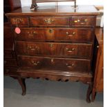 An 18th Century walnut and chestnut chest of three short and three long drawers, on stand fitted