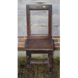 A 17th Century design oak stool with rectangular open back