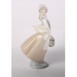 Three Lladro porcelain models of geese and two other larger figures of a lady and pigeons and a