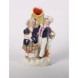 A pair of Staffordshire figures of "Summer" and "Winter", a Staffordshire spill vase, three 19th