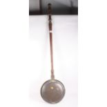 A 19th Century copper warming pan with turned wooden handle