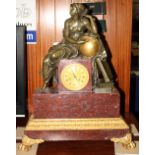 A French Empire bronze ormolu and rouge marble mantel clock with eight-day movement, decorated