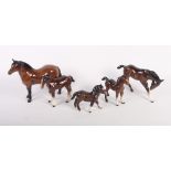 A Beswick model of a Dartmoor pony and four foals, various