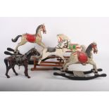 A collection of ten carved rocking and other horse models, eight Russian landmark building plates