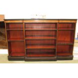 A mid Victorian ebonised and burr yew breakfront bookcase, fitted adjustable shelves, on block base,