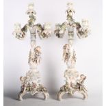 A pair of 19th Century Sitzendorf porcelain candelabra with flower encrusted decoration, 20" high (