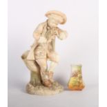 A Royal Worcester blush ivory figure of a dancing boy playing a pipe, 10" high (a/f), and a Royal