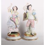 A pair of 19th Century French bisque porcelain dancing figures on circular bases, 9" high