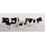 Two Beswick models of Friesian cattle, "Champion Coddington" and "Champion Claybury Leegwater" and a