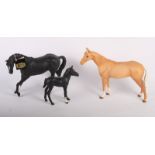 A Beswick model of a Palomino horse, matt glaze, 8" high, a similar matt glaze model of Black