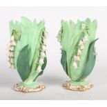 A pair of 19th Century Staffordshire "Lily of the Valley" porcelain vases, 4 1/2" high, and a pair