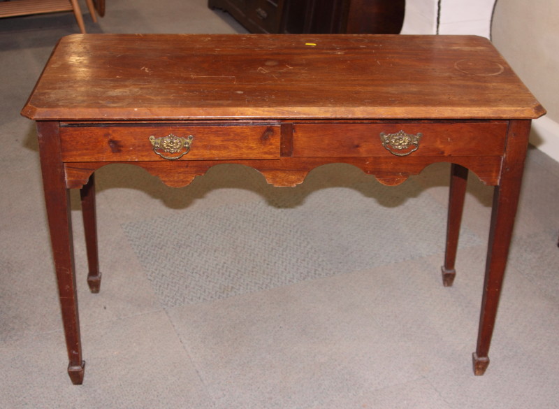 A Victorian mahogany side table, fitted two drawers, on square taper supports, 42" wide (top